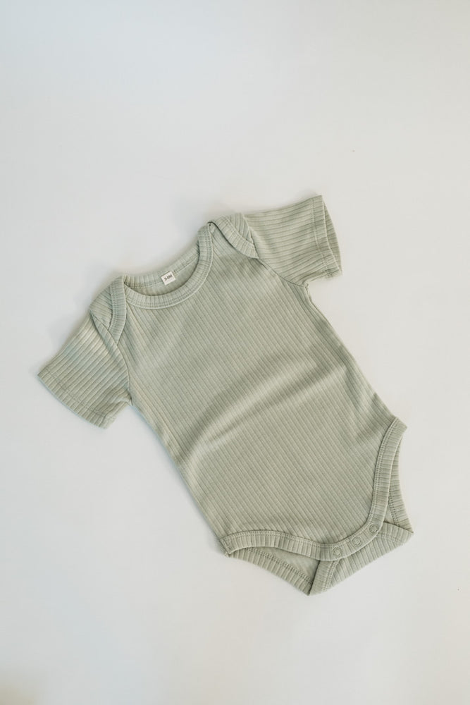 
                  
                    Short Sleeve Ribbed Bodysuit
                  
                